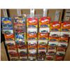 Image 2 : 31 N.I.P Assorted Chevrolet Hot Wheels and John Lightning Cars with Metal Display Shelf 10" by 70"T