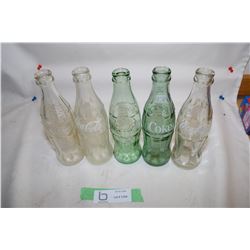 5 Coca-Cola Bottles