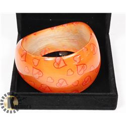ORANGE HARD PLASTIC BANGLE "LOVE" BRACELET