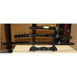 3 VARIOUS LENGTH DECOR SAMURAI KNIVES ON A STAND