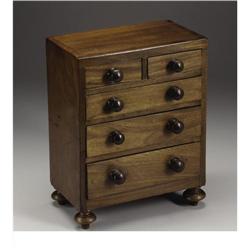 A Victorian Walnut Miniature Chest of Drawers 