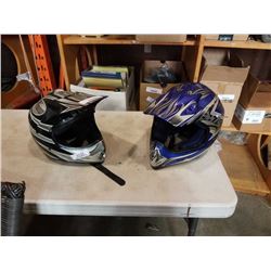 Two dirt bike helmets