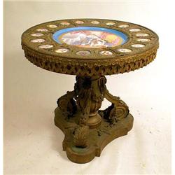 A PORCELAIN INSET BRASS AND GILTWOOD CE