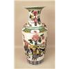 Image 1 : A POLYCHROME AND FLORAL DECORATED VASE