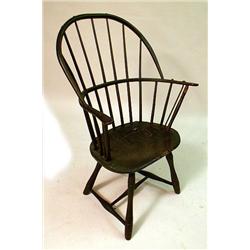 A BLACK PAINTED SACK BACK WINDSOR ARMCH