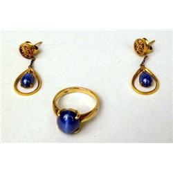 A 14K YELLOW GOLD AND STAR SAPPHIRE RIN