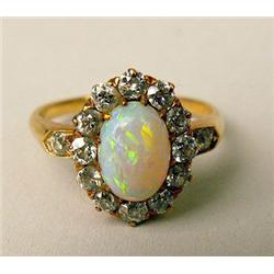 A 14K YELLOW GOLD, OPAL, AND DIAMOND RI