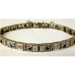 A PLATINUM AND 14K WHITE GOLD DIAMOND A