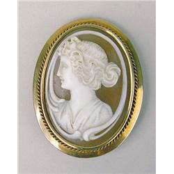 A CARVED SHELL CAMEO SET WITHIN A 14K Y