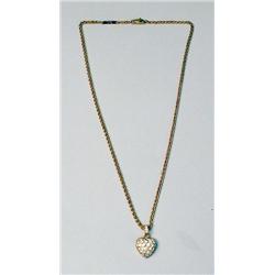 A CARTIER 18K GOLD AND DIAMOND HEART PE