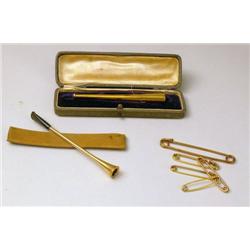 TWO YELLOW GOLD CIGARETTE HOLDERS
