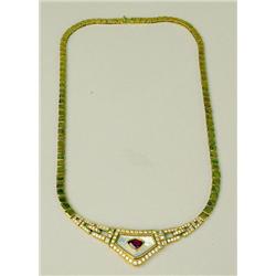 AN 18K YELLOW GOLD, RUBY, AND DIAMOND N