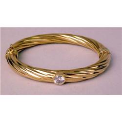 A 14K YELLOW GOLD ROPE TWIST BANGLE BRA