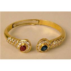 AN 18K YELLOW GOLD, DIAMOND, RUBY, AND 
