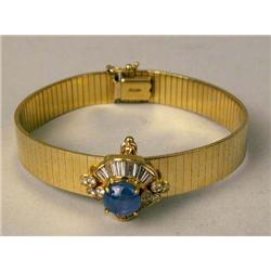A 14K YELLOW GOLD FLEXIBLE BANGLE BRACE
