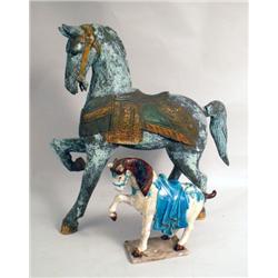 A CARVED WOODEN PRANCING HORSE REPLICA