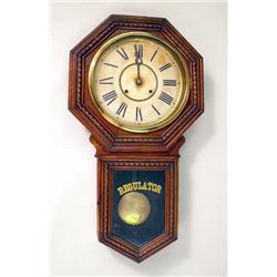 A CARVED OAK REGULATOR WALL CLOCK