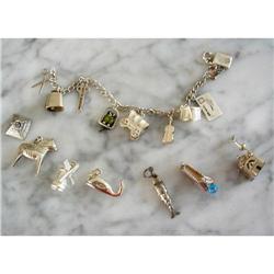 ANTIQUE STERLING (17) MOVABLE CHARMS BRACELET #1168761