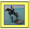 Image 1 : MINIATURE SILVER JOCKEY on HORSE JUMPING FENCE #1136827