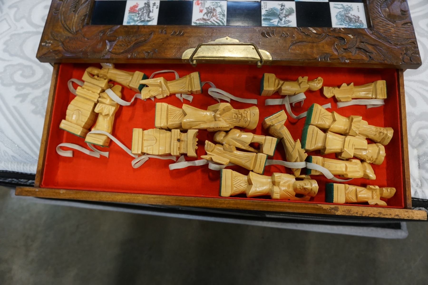 EASTERN CHESS SET WITH WOOD PIECES IN FOLDING WOOD BOX - Big Valley Auction