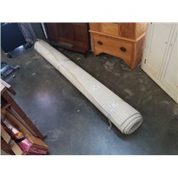 BEIGE AREA CARPET - APPROX 8 FOOT