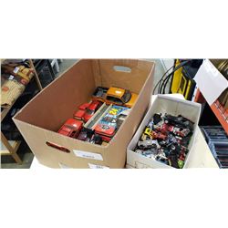 2 boxes of die cast and other vehicles