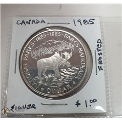 1985 CANADIAN SILVER DOLLAR COIN.