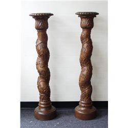 A pair of antique carved wood pedestals