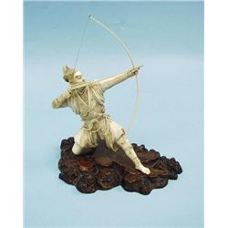 An antique Japanese carved ivory figure