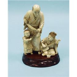 A rare antique Japanese carved ivory fi