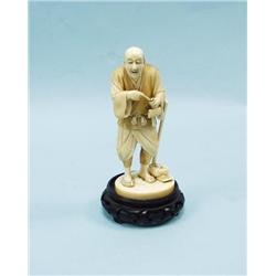 A well carved antique Japanese ivory fi
