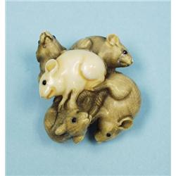 A well carved antique Japanese ivory ne