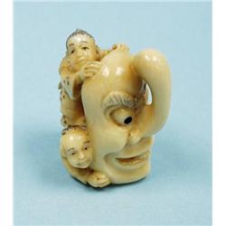 A well carved antique Japanese ivory ne