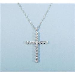 A platinum and diamond cross on matchin