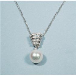 A swirl form 18 kt. white gold pendant 