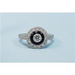 An 18 kt. white gold, onyx and diamond 