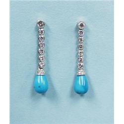 A pair of platinum and diamond pendant 