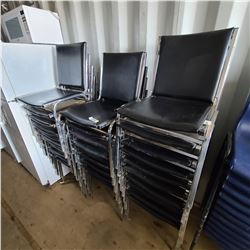 29 BLACK STACKING CHAIRS - LOCATED IN FORT MCMURRAY