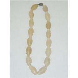 18" STRAND OF CARVED OFF-WHITE QUARTZ B