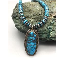 High-grade Turquoise Pendant on a Disk Bead Necklace