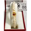 Image 1 : Stunning Cultured Pearl Bangle with Ruby Clasp. Round Bangle in 22k Gold Plate with a Continuous Lin