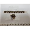 Image 1 : 792.  Gold tone and black bracelet and broach