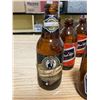 Image 9 : 18 SHORT BOTTLE NECK BOTTLES + 3 REG. SIZE BEER BOTTLES