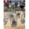 Image 4 : 7 CLEAR BOTTLES + ONE BROWN BOTTLE/JUG