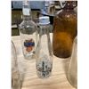 Image 6 : 7 CLEAR BOTTLES + ONE BROWN BOTTLE/JUG