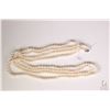 Image 1 : Strand of freshwater cultured 74" pearl necklace with white metal clasp. Retail replacement value $1