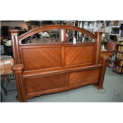 King sized headboard, footboard and rails with wrought iron and carved rope style accents