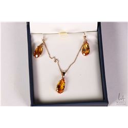 10kt yellow gold and topaz gemstone set earrings with matching pendant on a 10kt yellow gold 15" nec