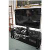 Image 1 : Toshiba model 40RV525R flat screen television mounted to smoked glass table/ stand plus a Toshiba SD