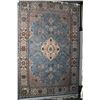 Image 1 : Large wool blend area carpet with center medallion, floral and foliage design in shades of blue, tau